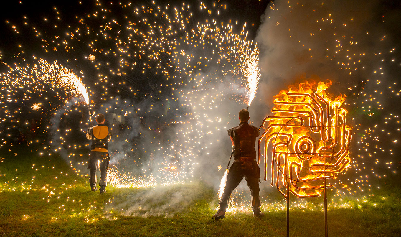 Tricks with fire in the bonfire field after dark