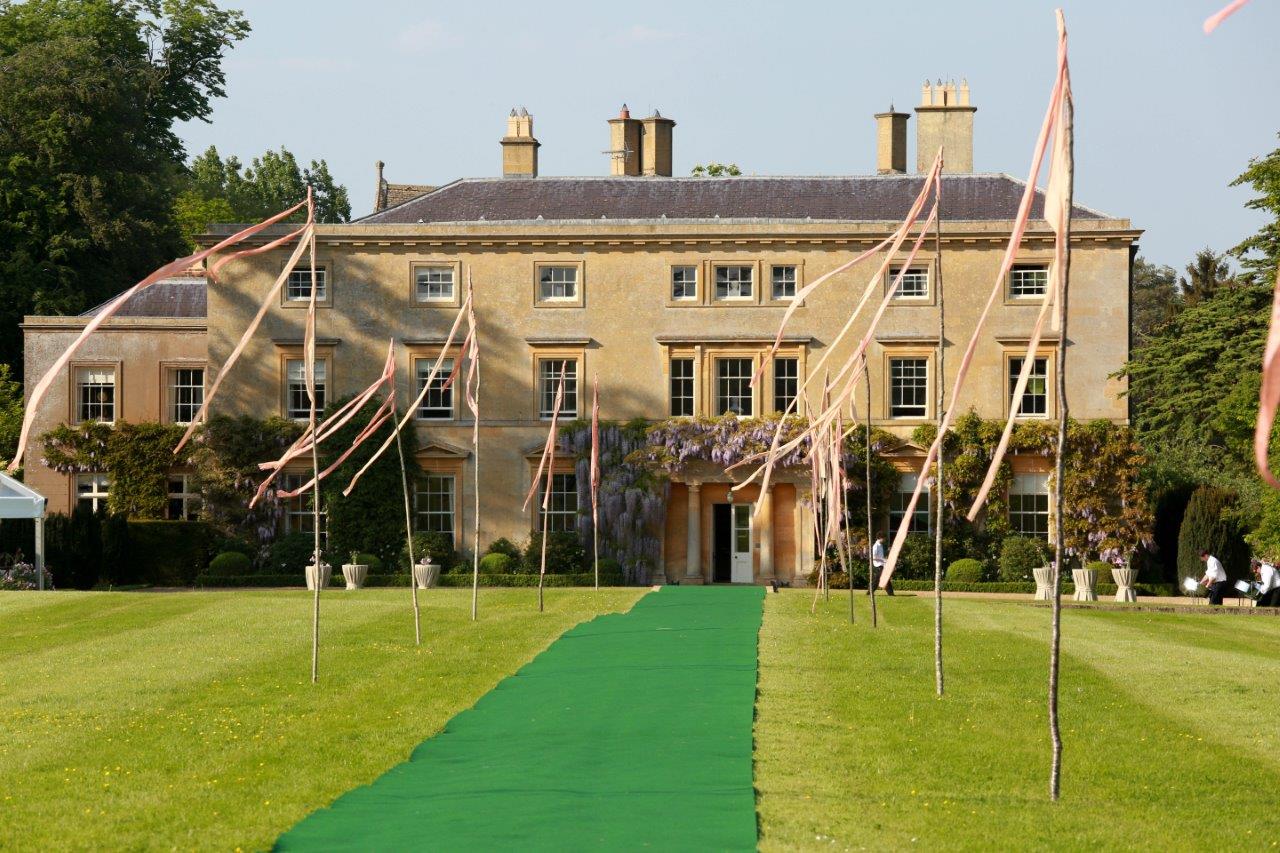 Floaty fabric at the top of birch-poles to create an arrival avenue